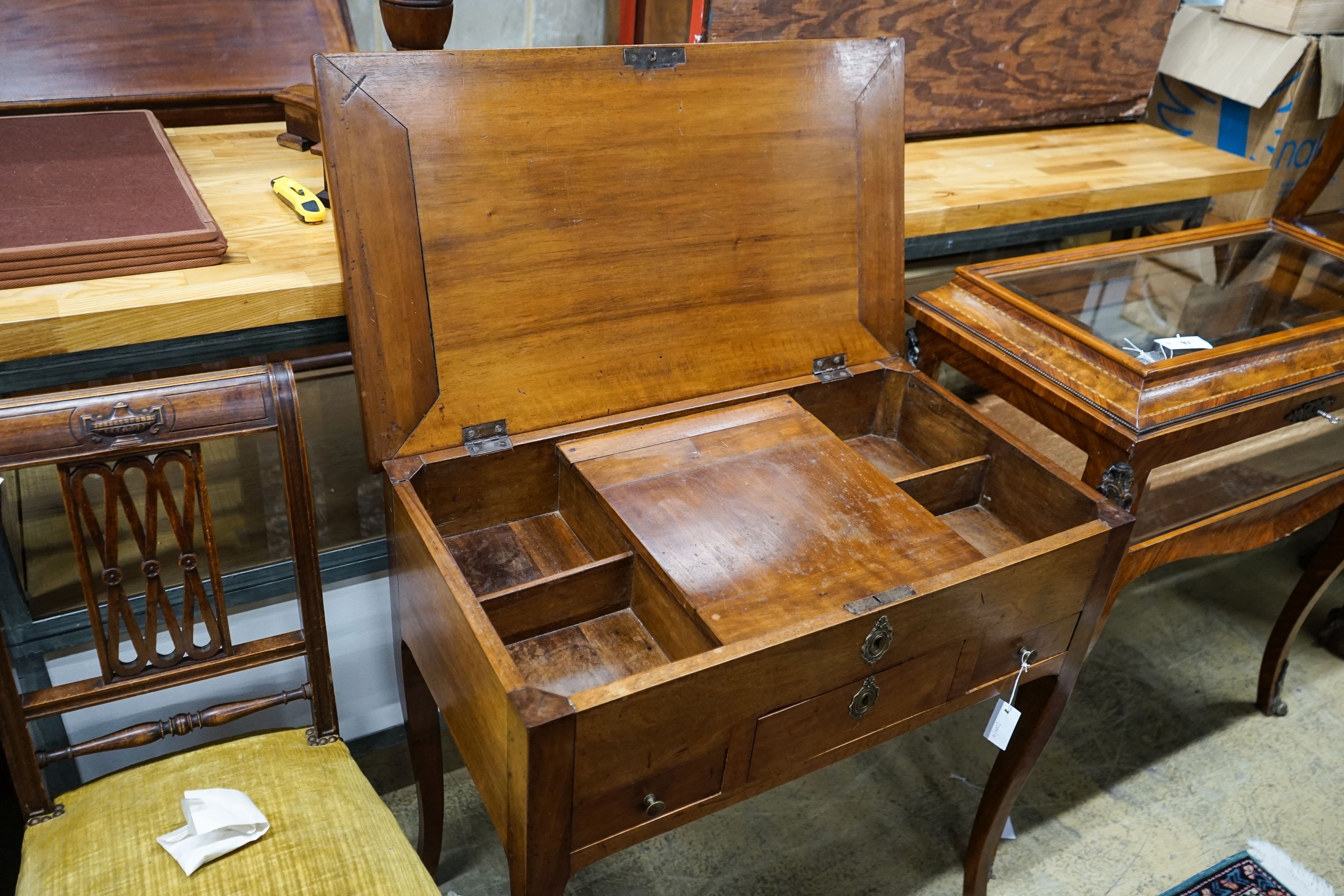 A 19th century French fruitwood enclosed dressing table with rectangular hinged top, width 78cm, depth 45cm, height 76cm